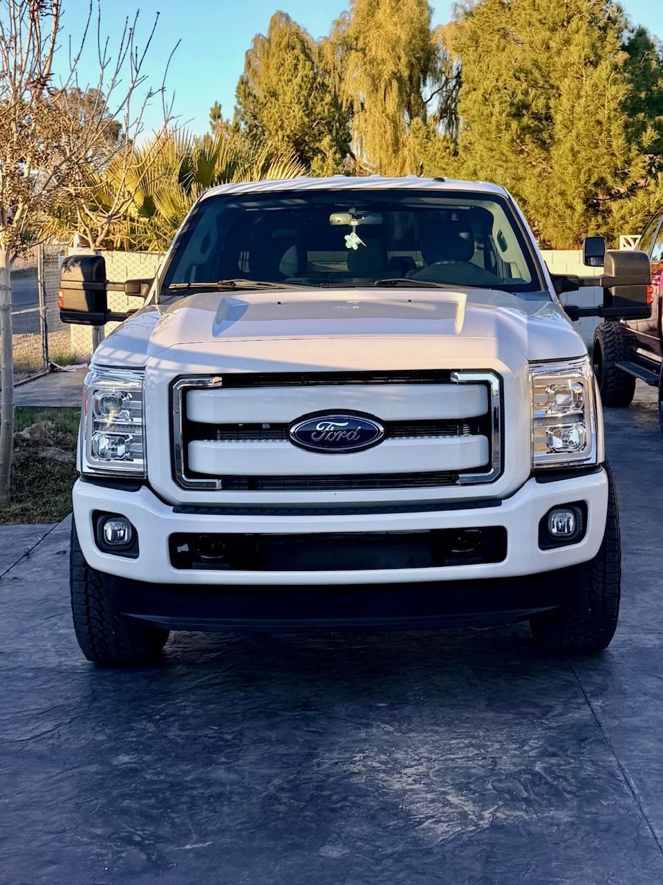 White Ford F-250 Super Duty Platinum truck, front view